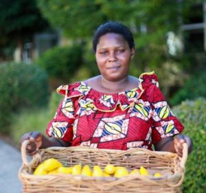 Happiness Farm owner holding a basket