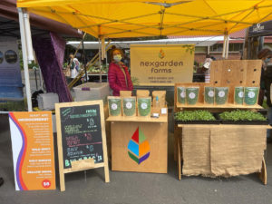 farmers market vendor at their booth