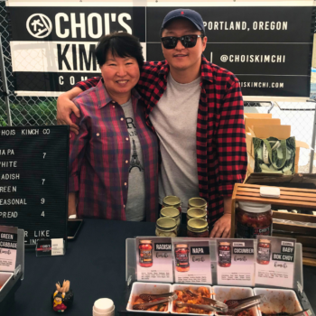 photo of two people selling at a farmers market